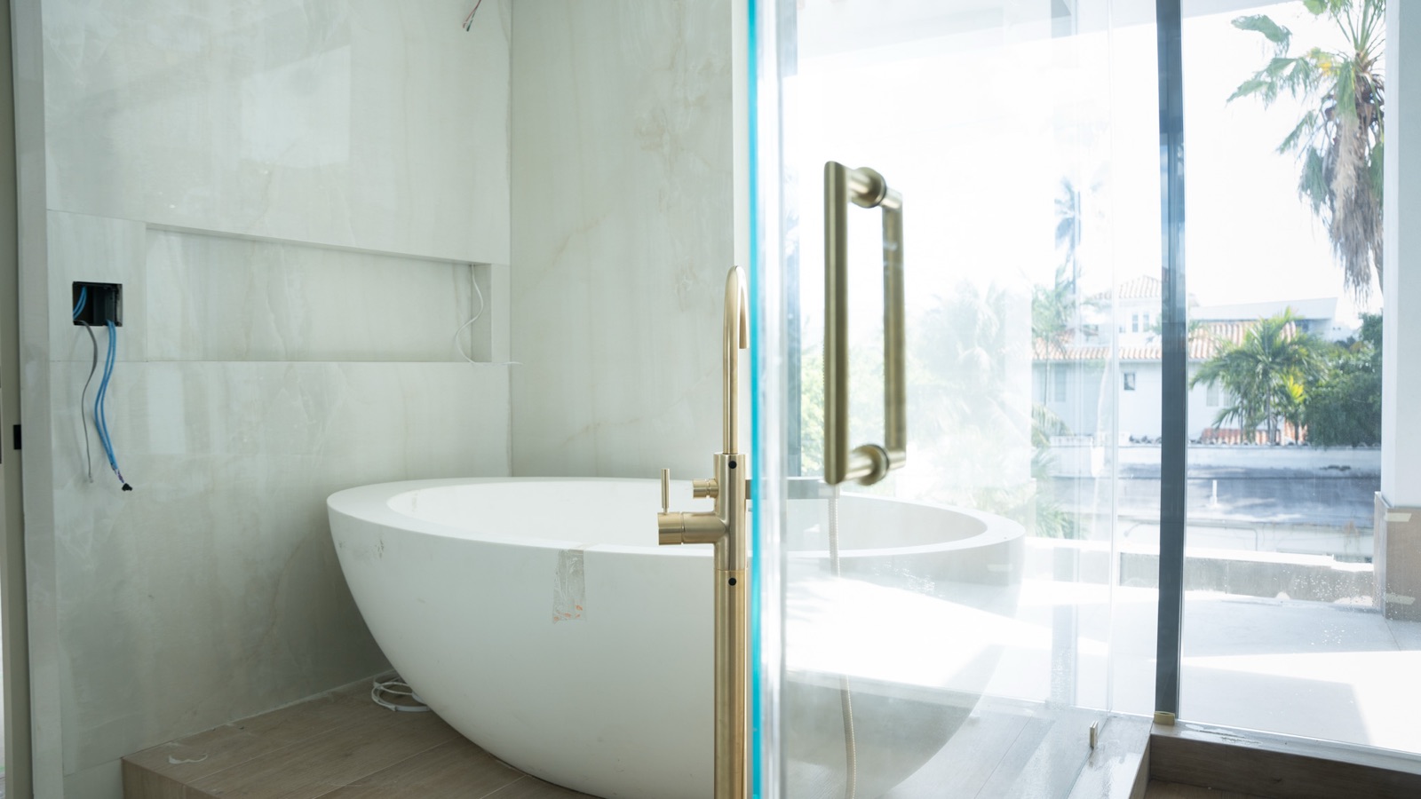 Freestanding soaking tub in a remodeled bathroom